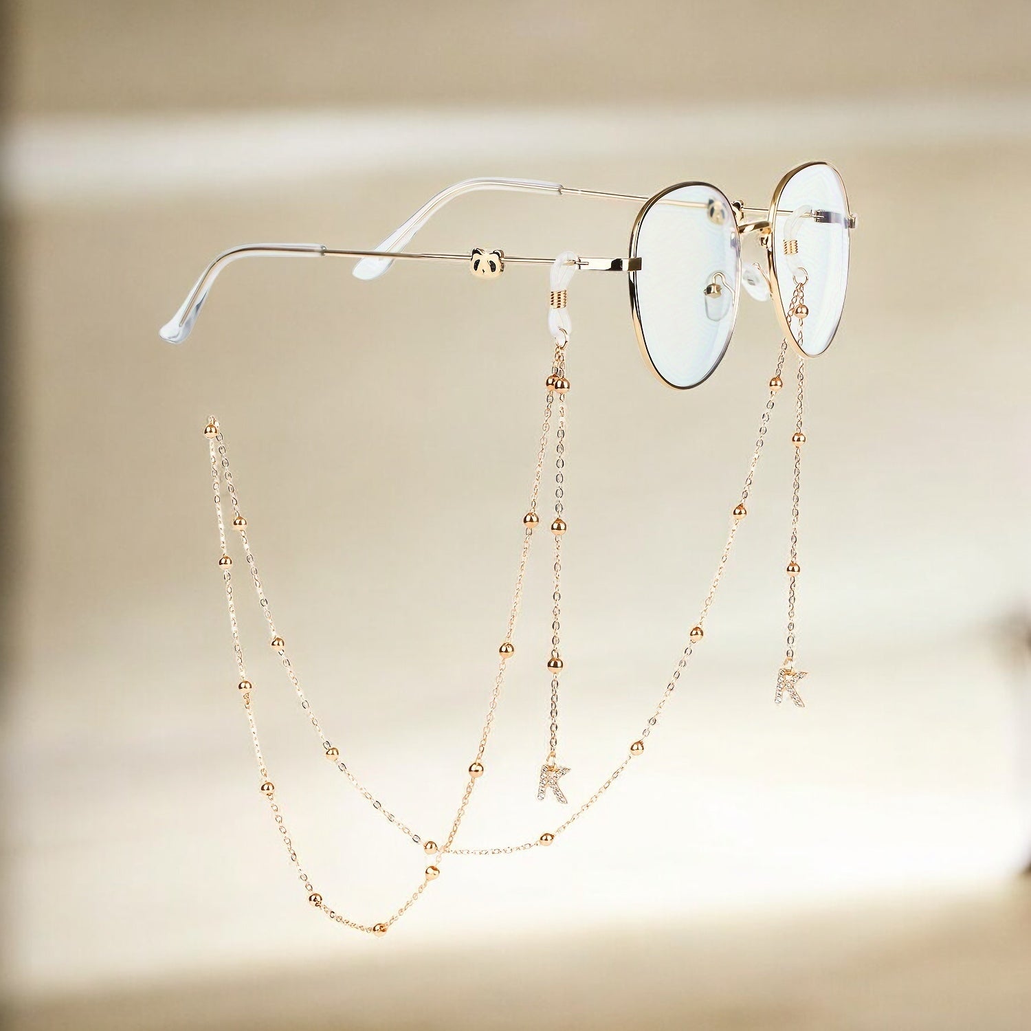 Laroche™ | Chaîne de Lunettes Dorée avec Breloques – Élégante et Raffinée